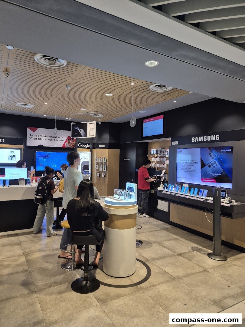 Interior of a Singtel store showcasing Samsung phones and home entertainment plans.