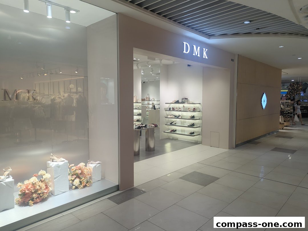 The DMK shop entrance with shoes displayed on shelves and in the window.