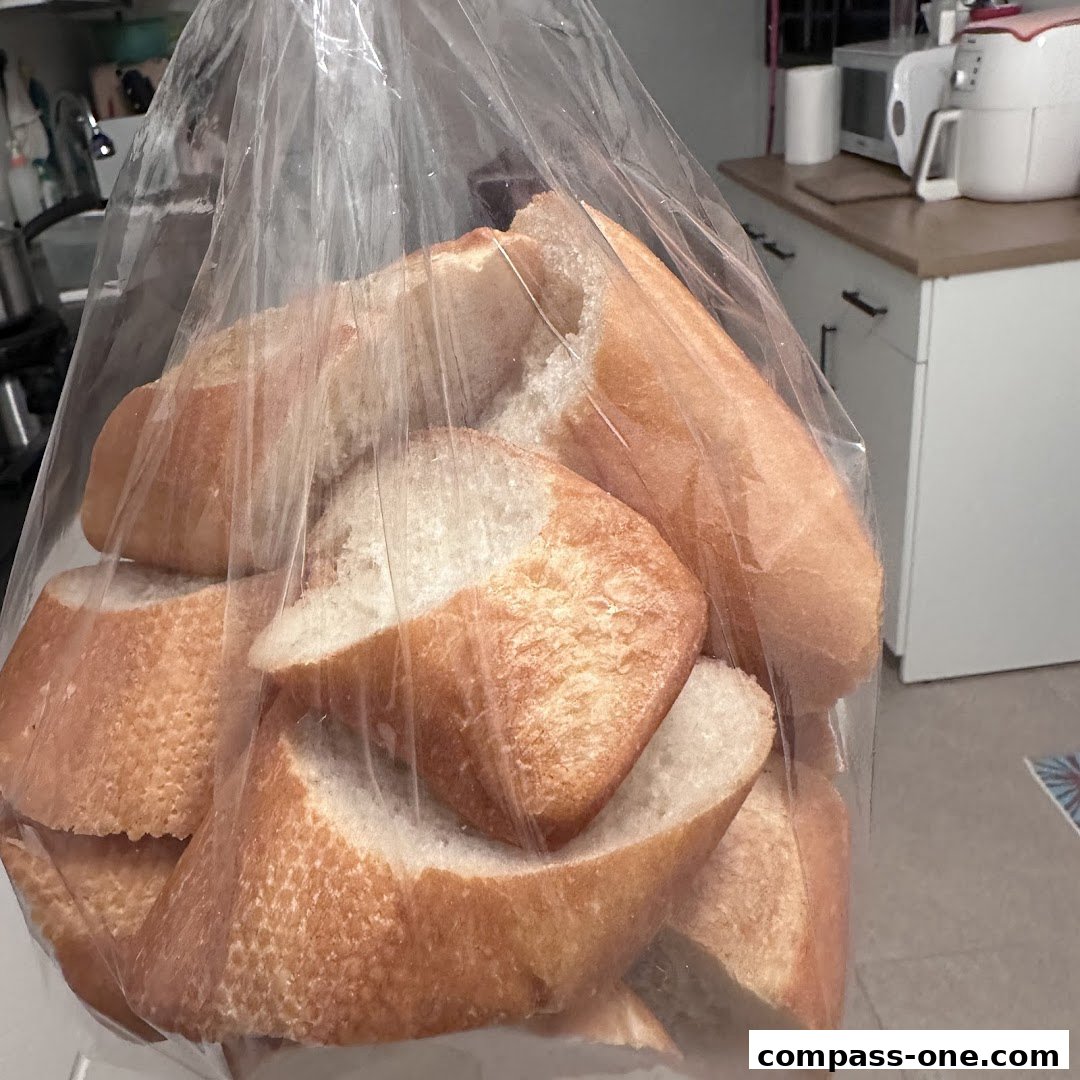 A clear plastic bag filled with freshly baked, sliced bread loaves.