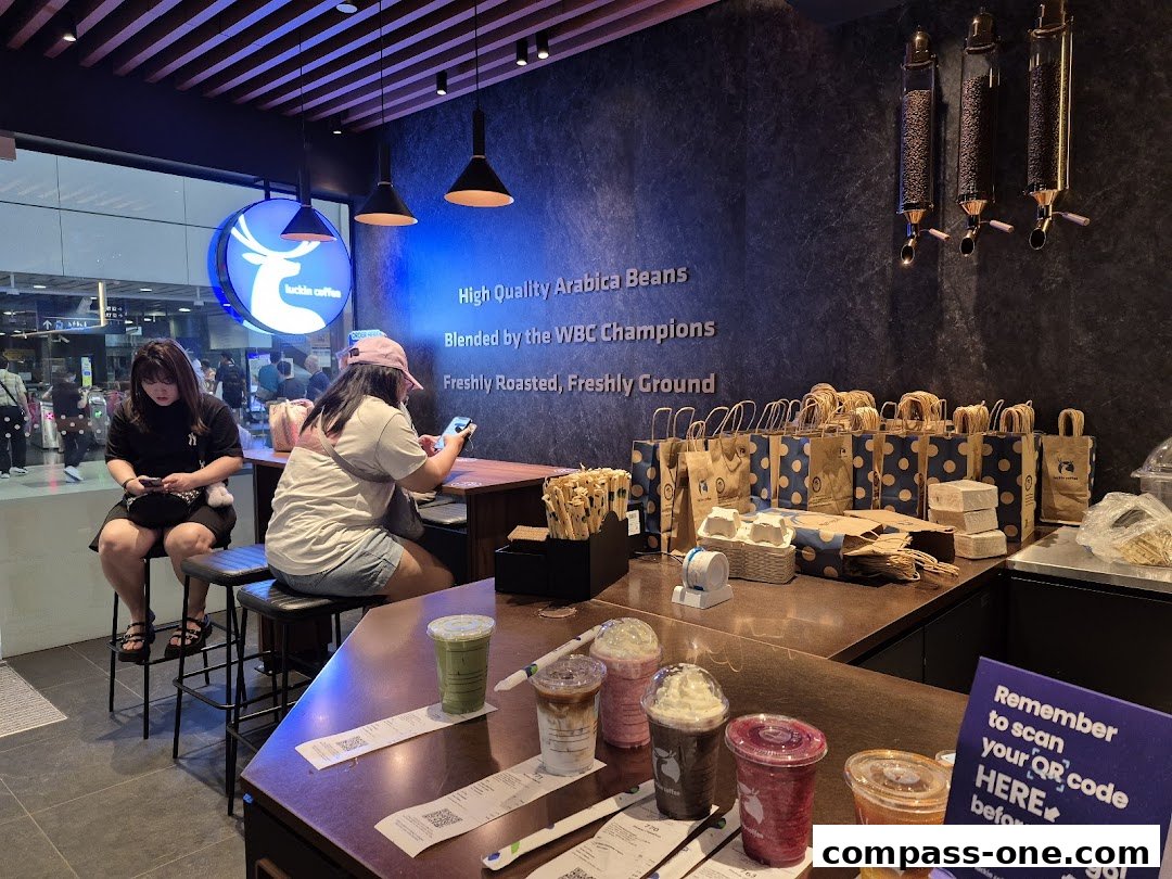 Interior of a Luckin Coffee shop with customers and drinks on the counter.