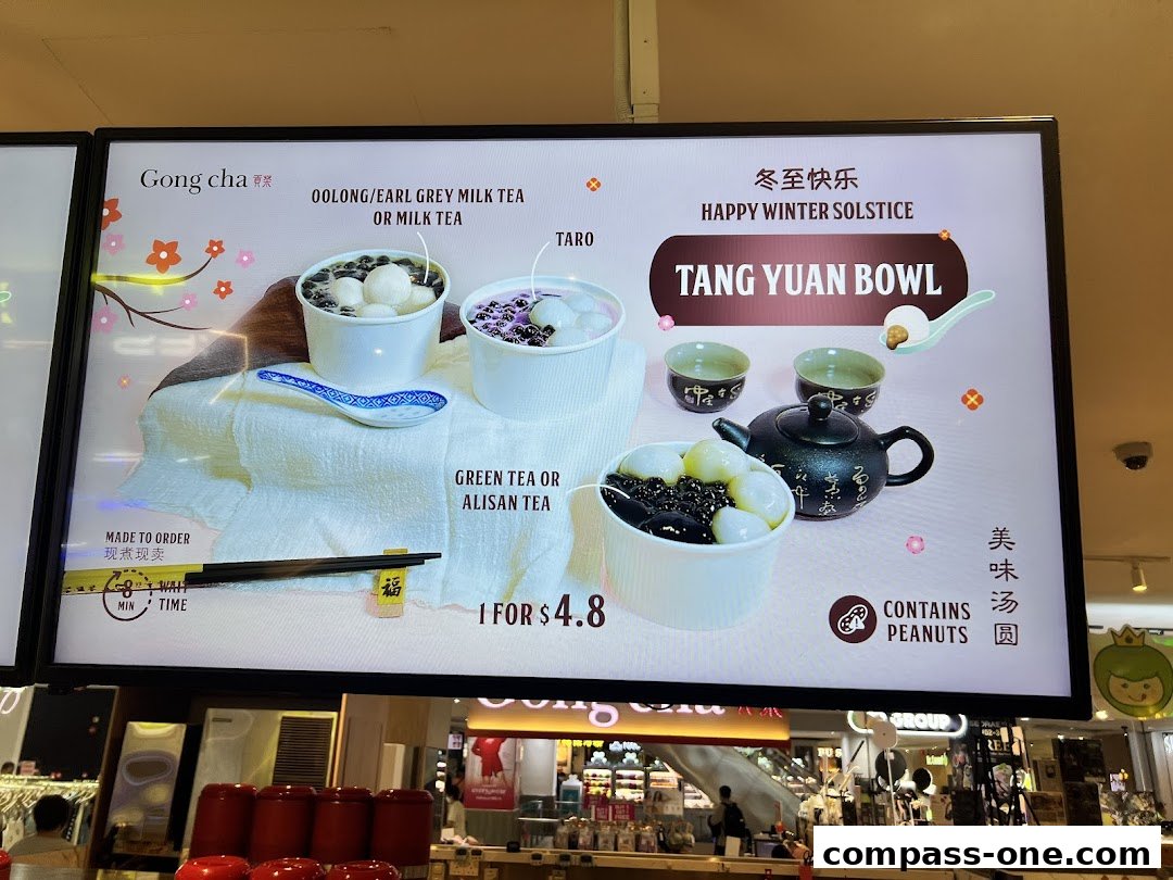 A Gong Cha menu board featuring milk teas and a Tang Yuan Bowl.