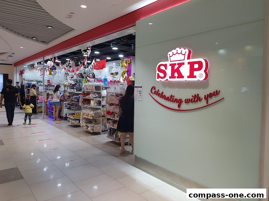 The exterior of the SKP shop, showcasing its logo and a display of party supplies.