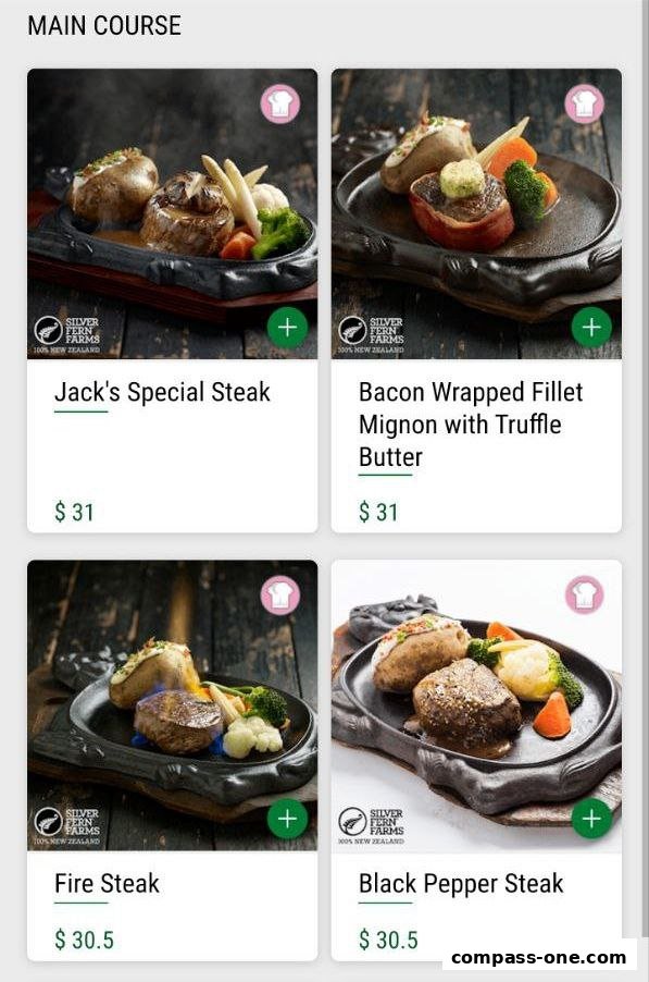 A menu display showing four main course steak dishes with prices.