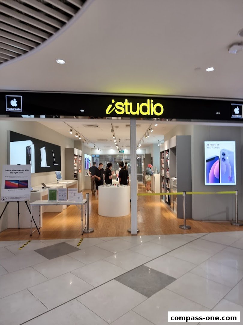 The entrance of an iStudio Apple Premium Reseller store with products displayed inside.