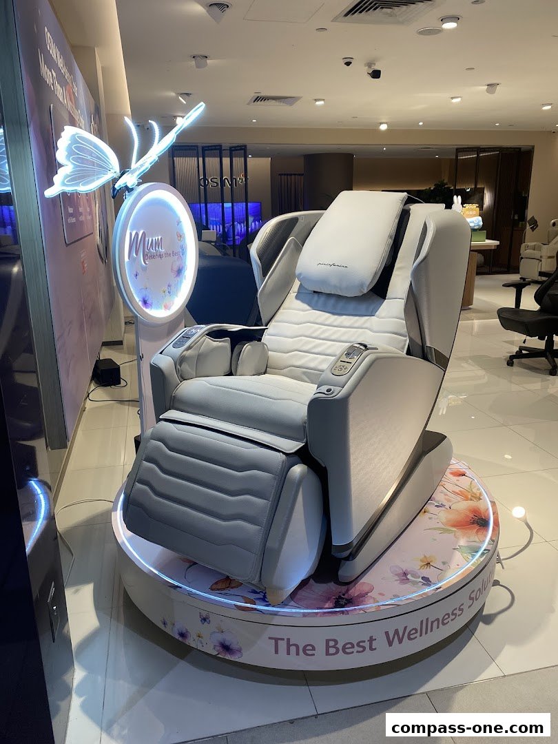 A luxurious massage chair displayed in a modern retail store with butterfly and floral decor.