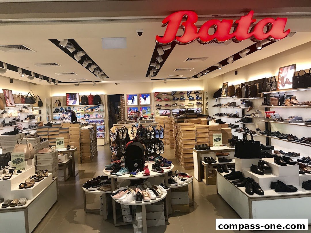 Interior view of a Bata shoe store showcasing a wide variety of footwear and handbags.