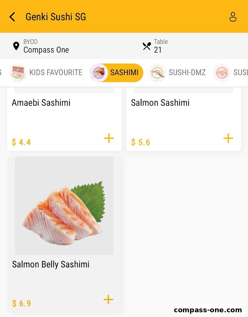 A digital menu displaying various sashimi dishes with prices at Genki Sushi.