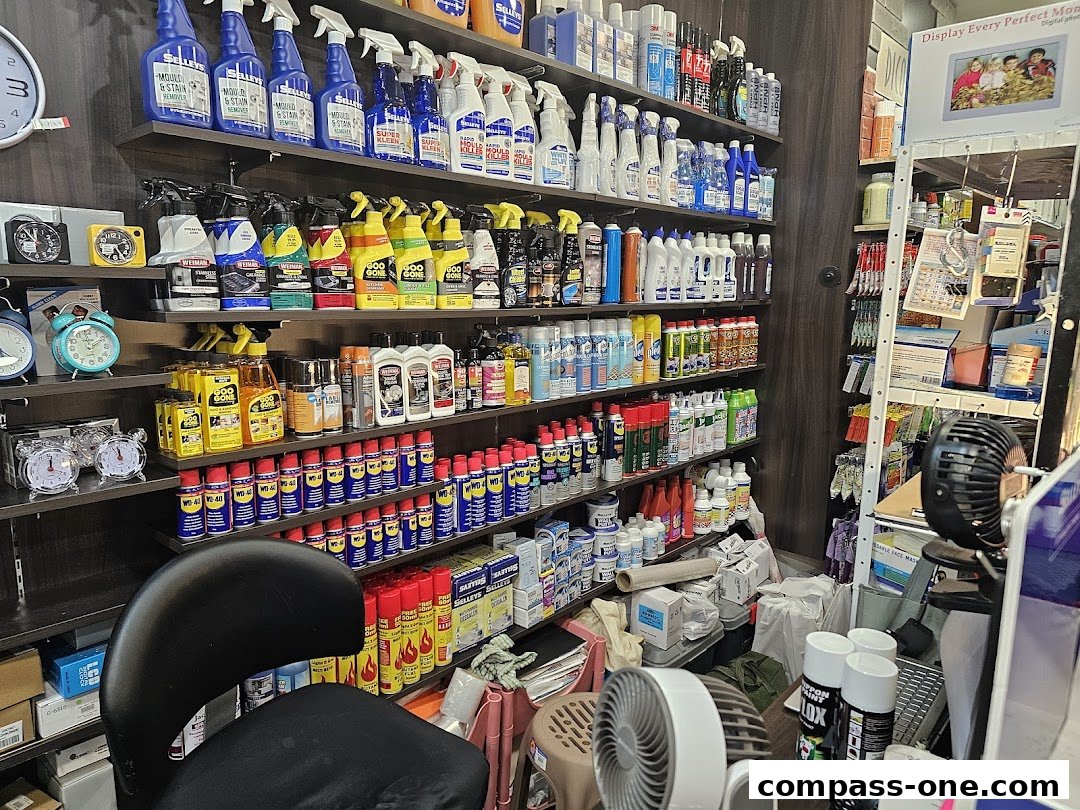 Shelves stocked with cleaning supplies, spray bottles, and household products.