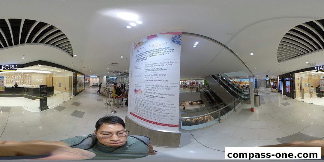 The entrance of Stalford Learning Centre at Compass One mall, with a promotional poster.