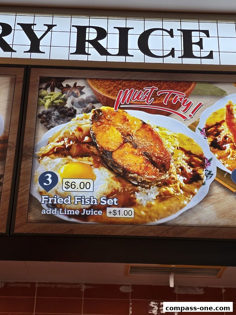 A close-up of a menu item featuring a fried fish set with rice and a fried egg.