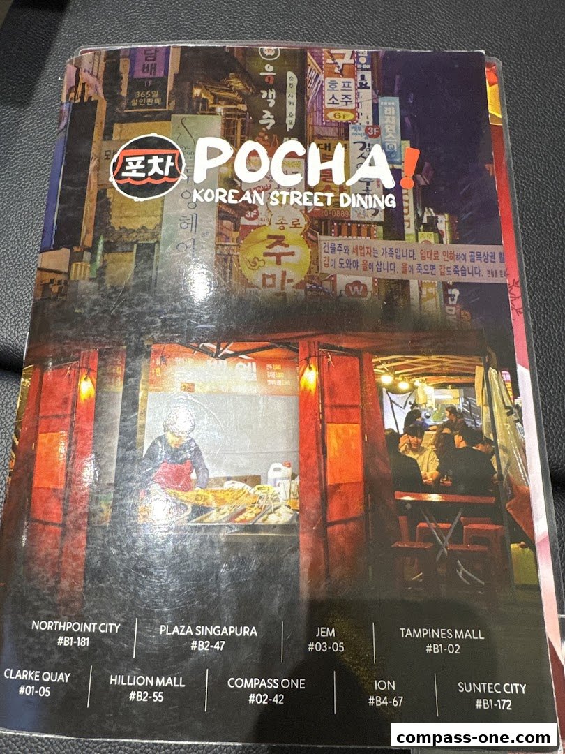 A menu cover for POCHA! Korean Street Dining featuring vibrant street scenes and restaurant locations.