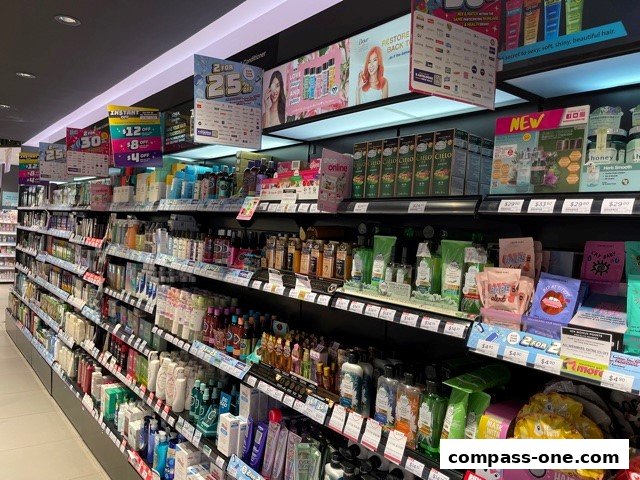 A wide aisle of a Watsons store showcasing a variety of health and beauty products on shelves.