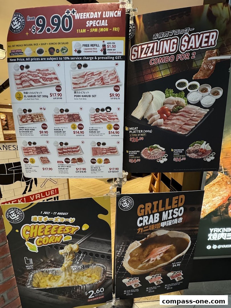 A display of various Yakiniku Like menu specials and promotions, including lunch sets and combo meals.