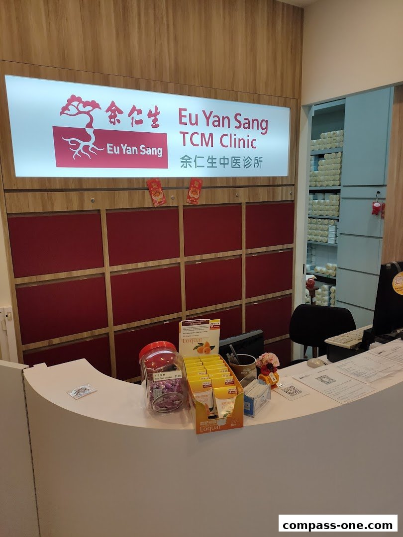The reception counter of Eu Yan Sang TCM Clinic with a prominent sign and various products on display.