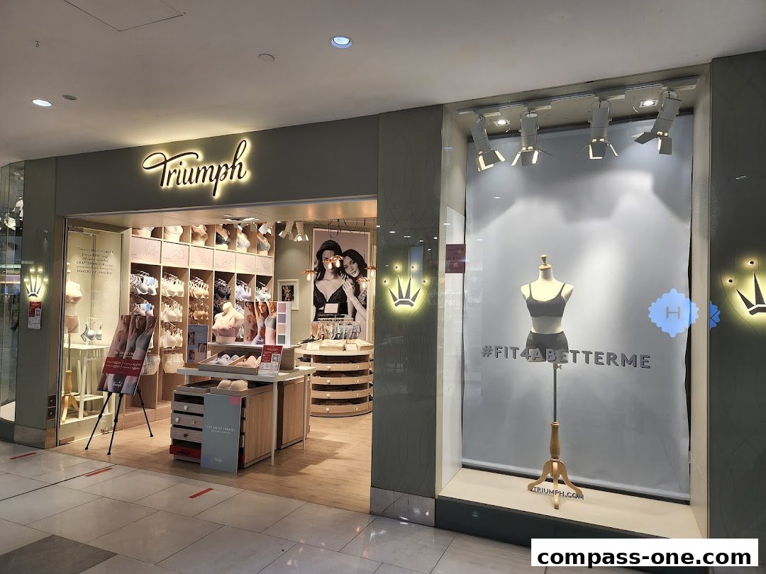 The Triumph lingerie shop features a well-lit interior with displays of bras and a mannequin in the window.