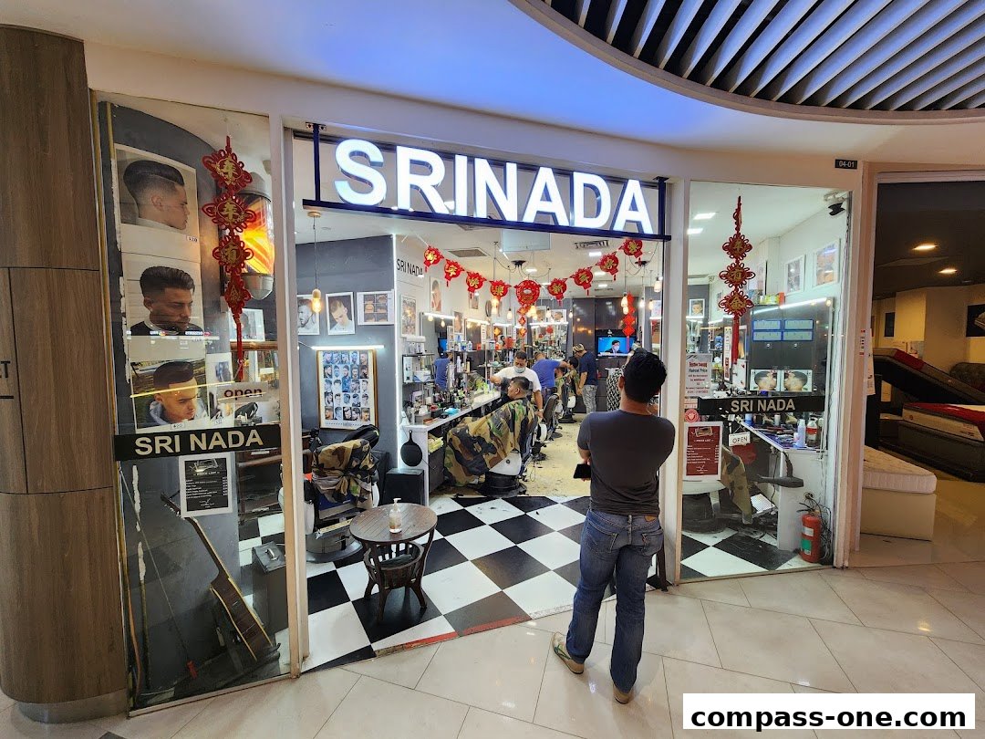 The exterior of Sri Nada Hairdressing Salon, showcasing barbers at work and stylish haircut examples.
