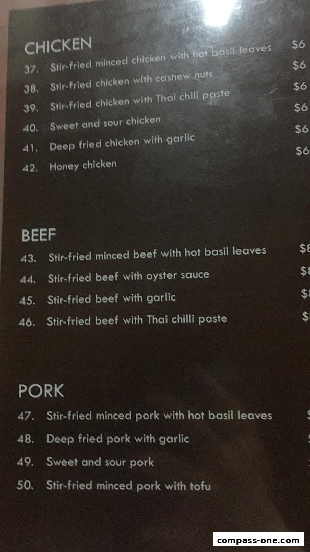 A menu from Nakhon Kitchen featuring chicken, beef, and pork dishes with prices.