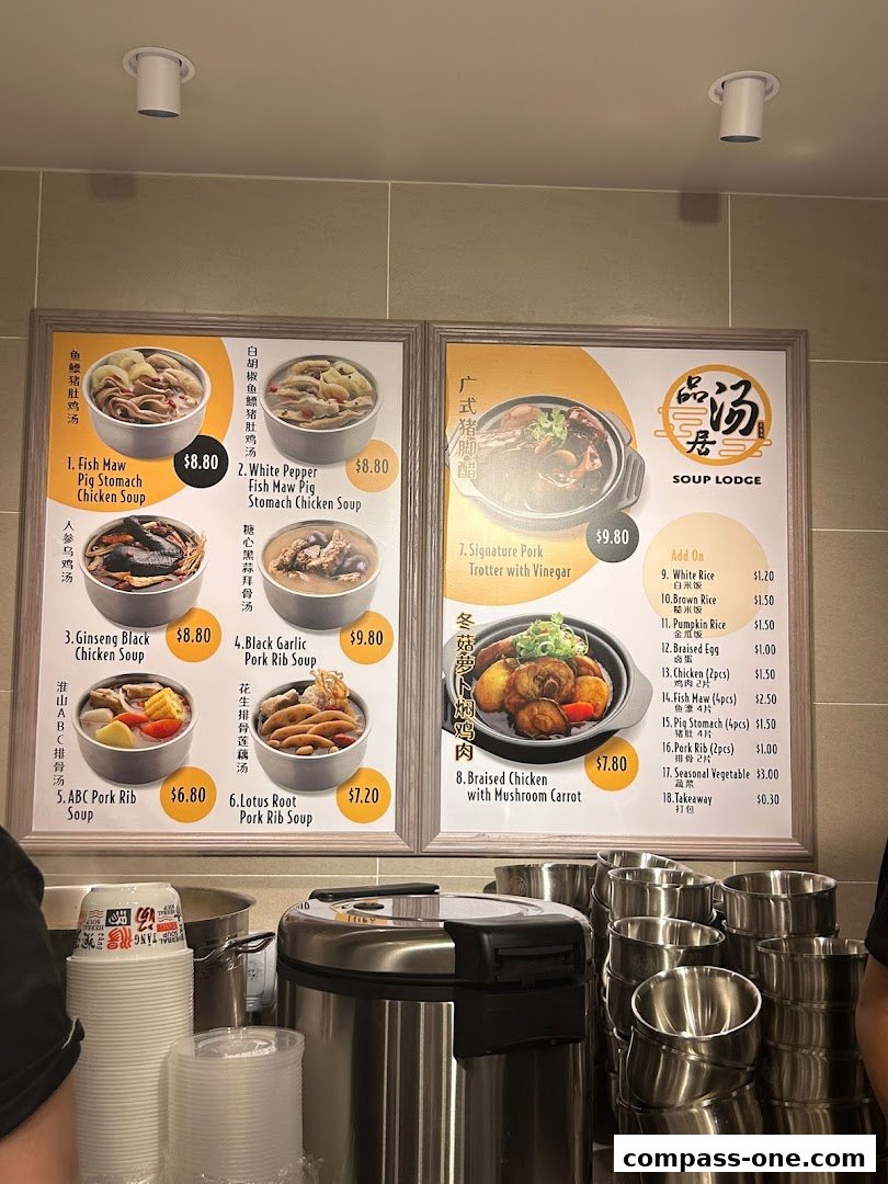 A menu board displaying various soups and side dishes with prices.