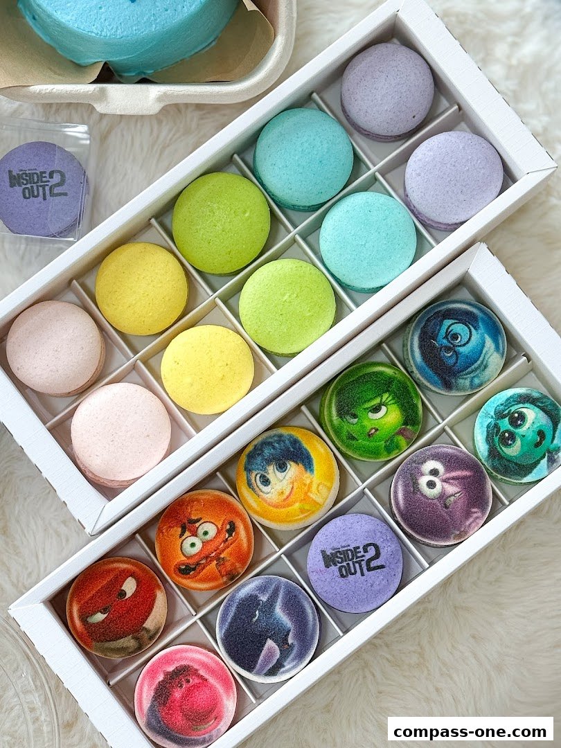 A close-up of colorful macarons, some featuring characters from Inside Out 2.