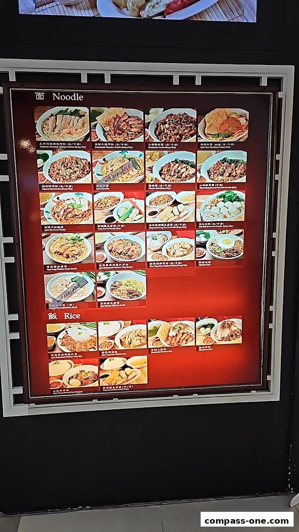 A menu board displaying various noodle and rice dishes with appetizing images.