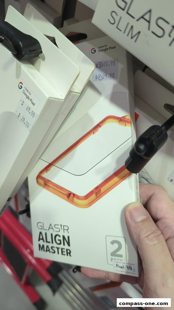 A hand holds a package for a screen protector for Google Pixel phones.