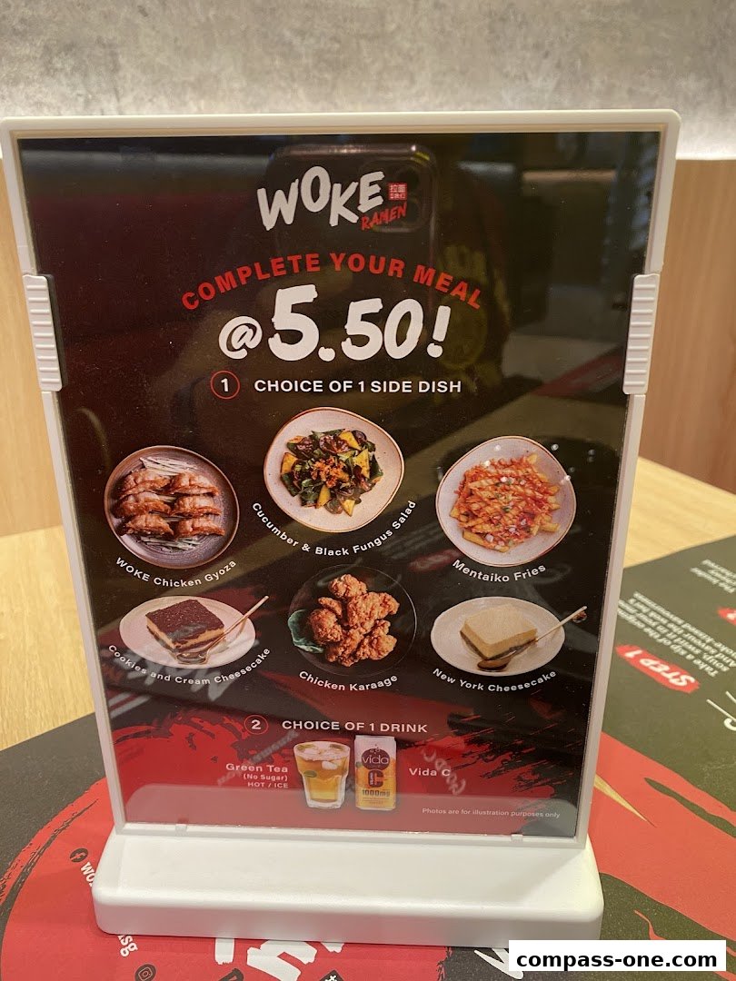 A menu board for WOKE Ramen offering a complete meal deal at $5.50.