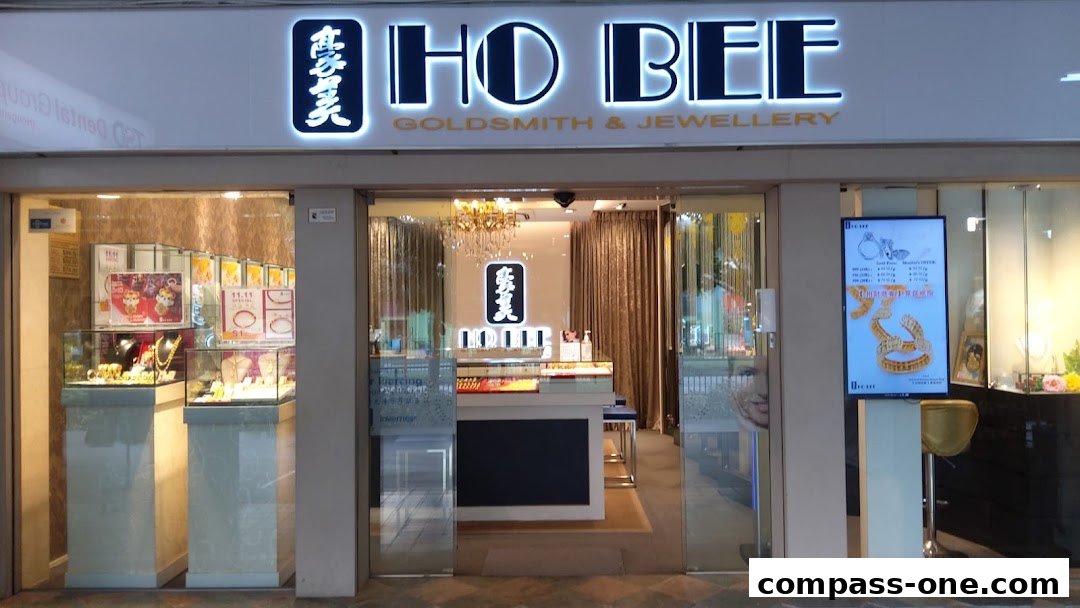 The exterior of Ho Bee Goldsmith & Jewellery, showcasing elegant displays of gold and jewelry.