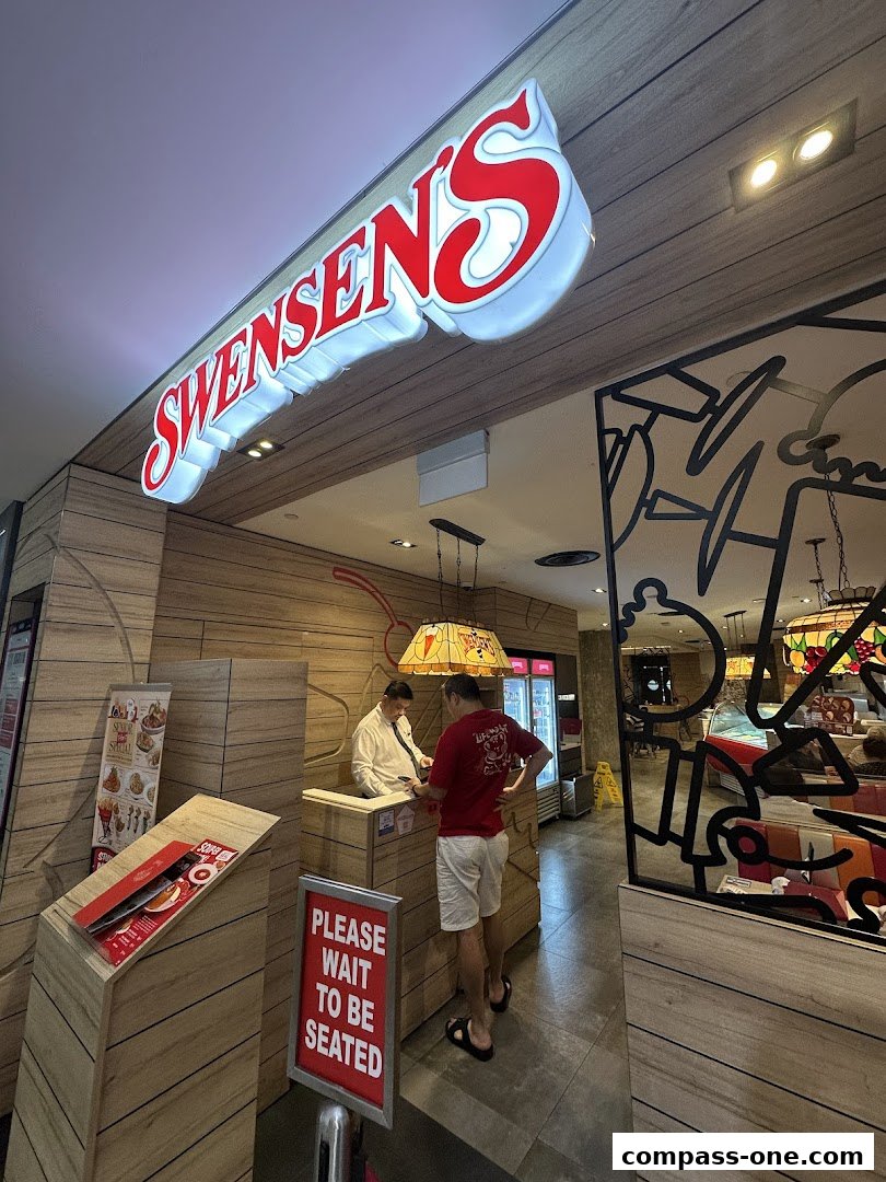 Swensen's restaurant entrance with a prominent sign and customers waiting to be seated.