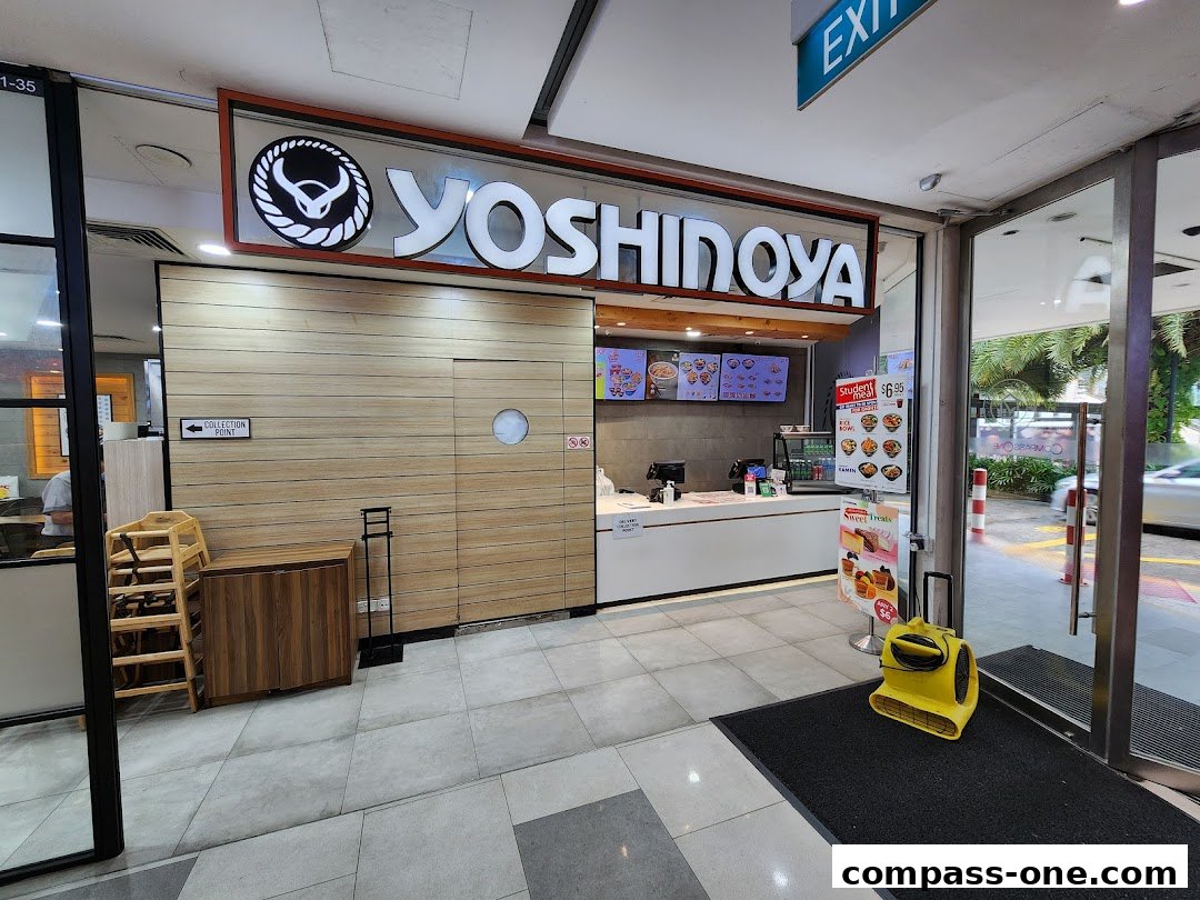 The exterior of a Yoshinoya restaurant with its prominent signage and a clean, modern interior visible.