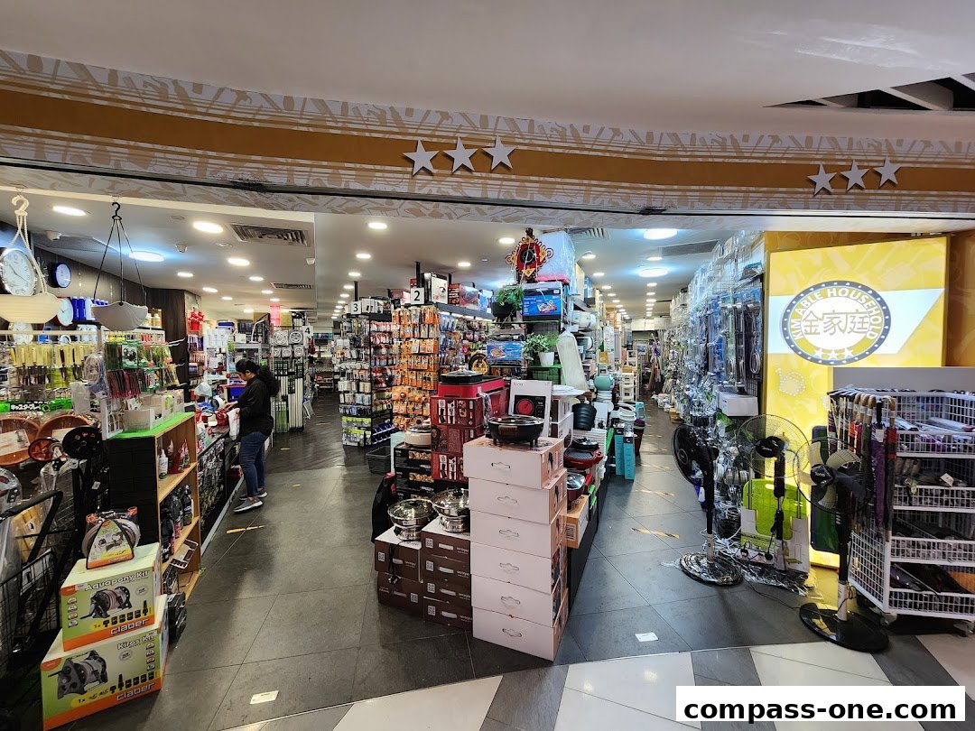 Interior view of a well-stocked household goods store with various kitchenware and appliances.