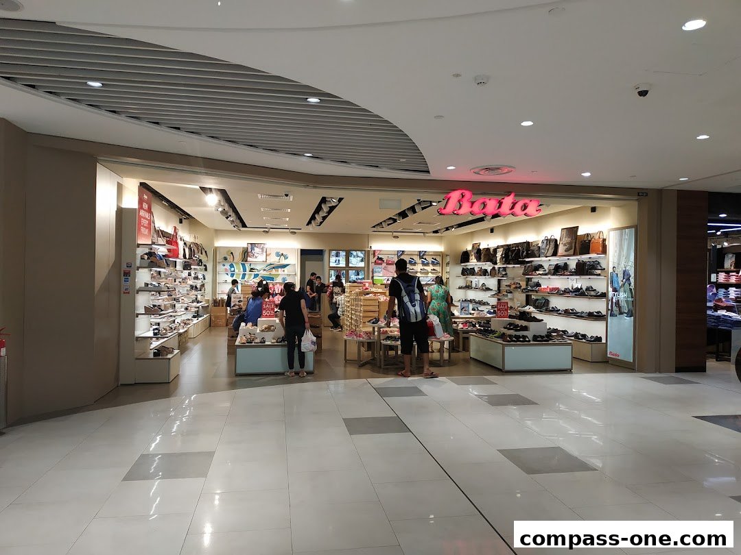 The Bata shoe store entrance with displays of shoes and bags, and customers browsing.