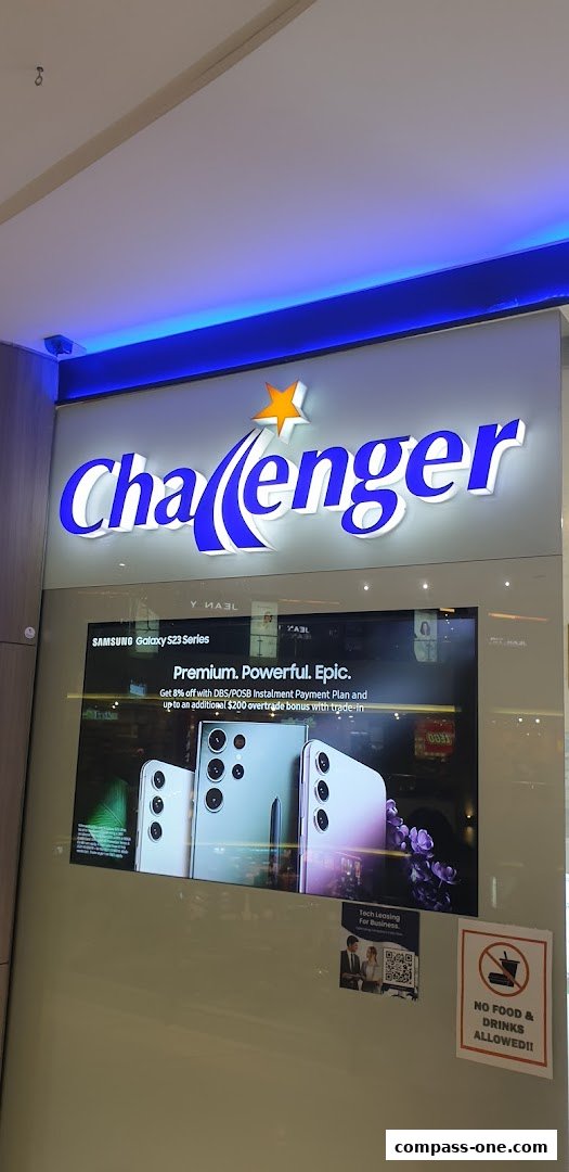 The Challenger store front features a prominent illuminated sign and a digital display showcasing the Samsung Galaxy S23 Series.