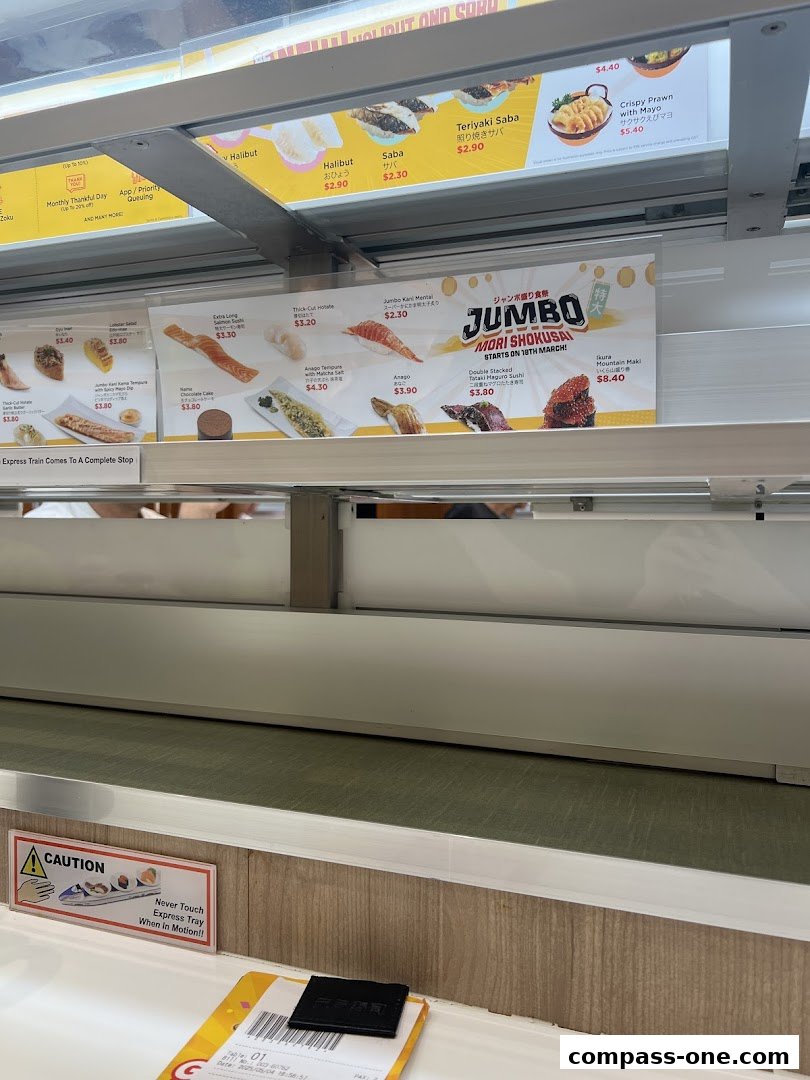 A conveyor belt sushi restaurant menu displaying various sushi items and prices.