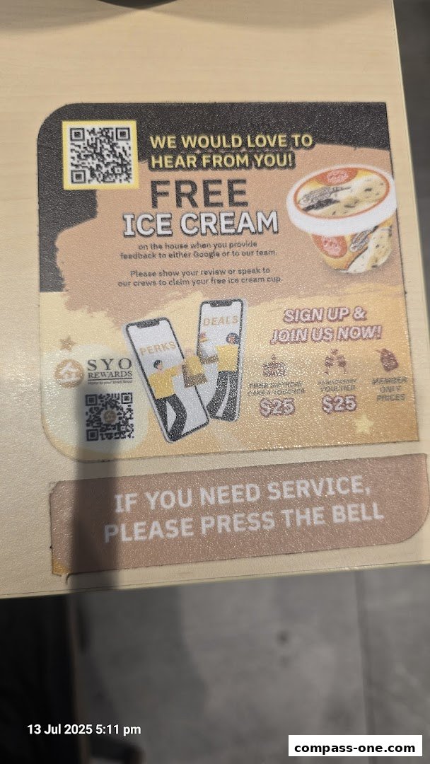 A sign offering free ice cream for feedback and promoting membership deals.