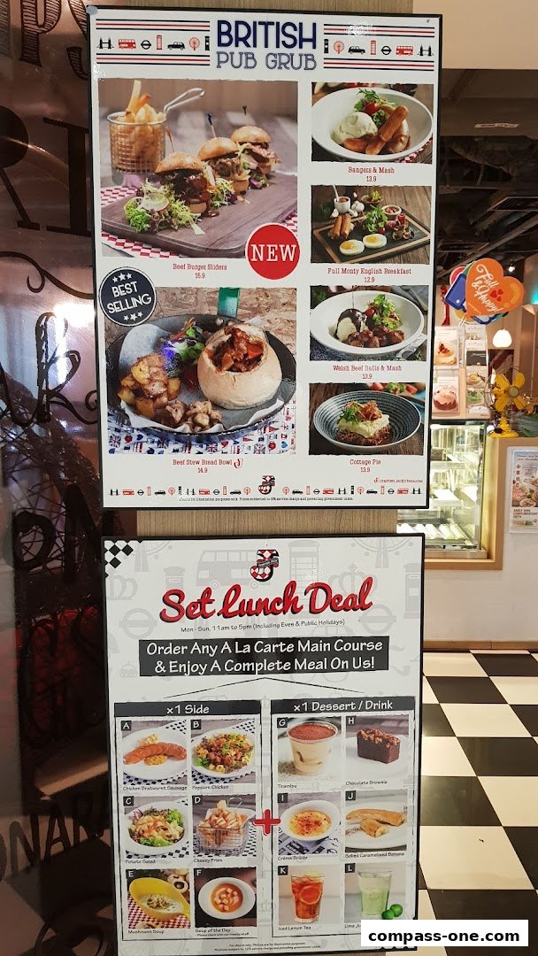 A menu board showcasing British pub food and a set lunch deal with various meal options.