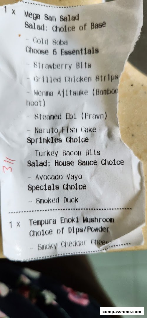 A receipt detailing a Mega San Salad and Tempura Enoki Mushroom order with various customization options.