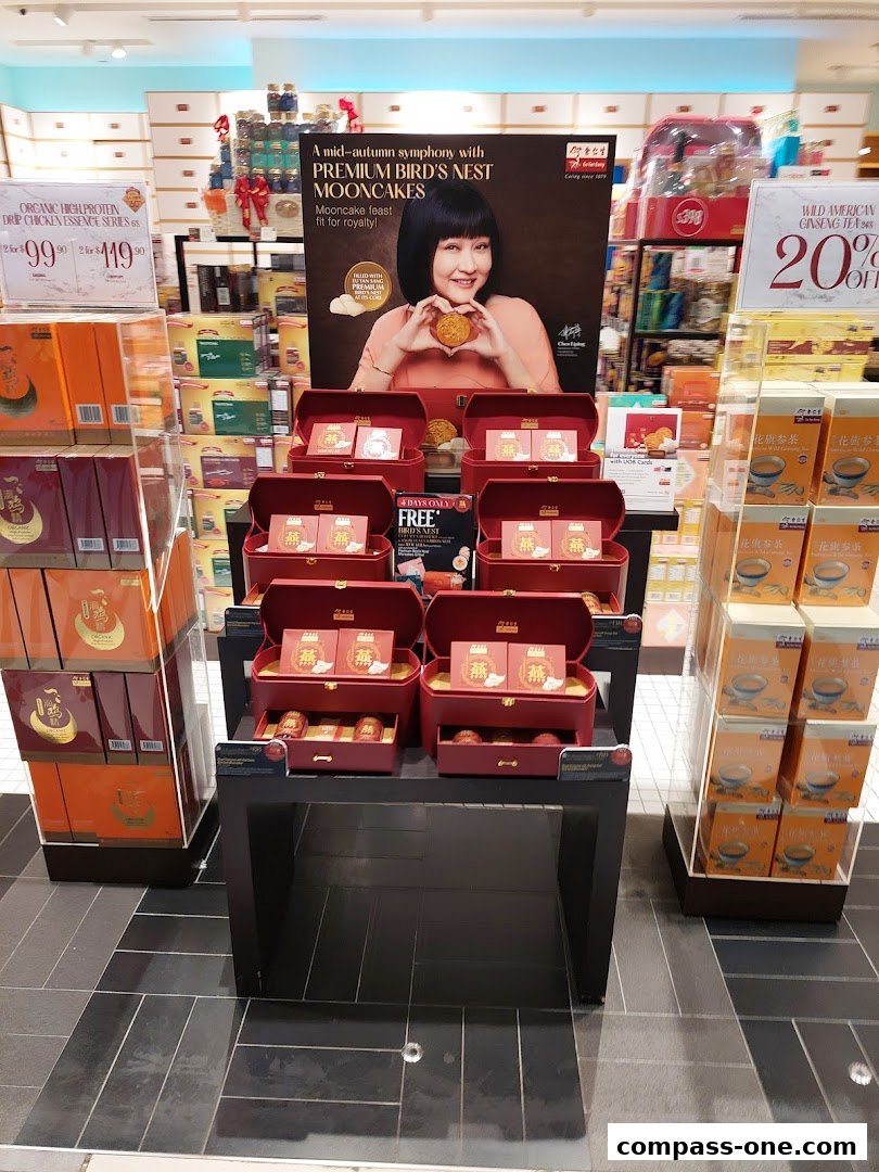 Eu Yan Sang shop display featuring premium bird's nest mooncakes and ginseng tea.