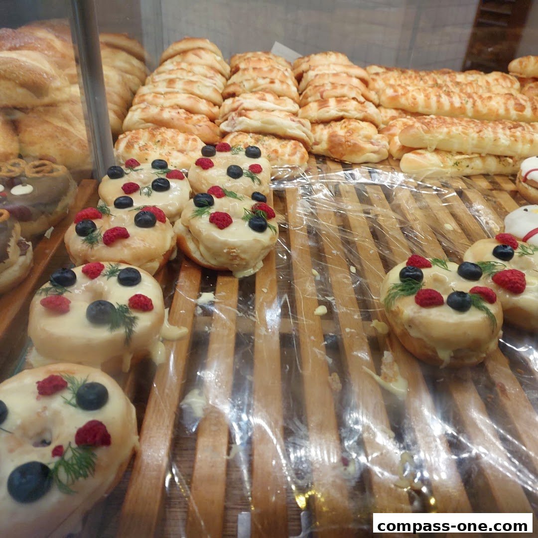 A display of freshly baked bread and decorated donuts at BreadTalk.