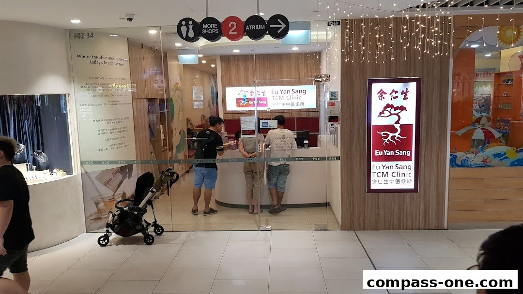 The entrance of Eu Yan Sang TCM Clinic with staff and customers at the counter.