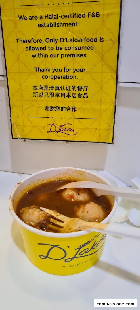 A cup of Asam Laksa from D'Laksa with a sign about Halal certification.