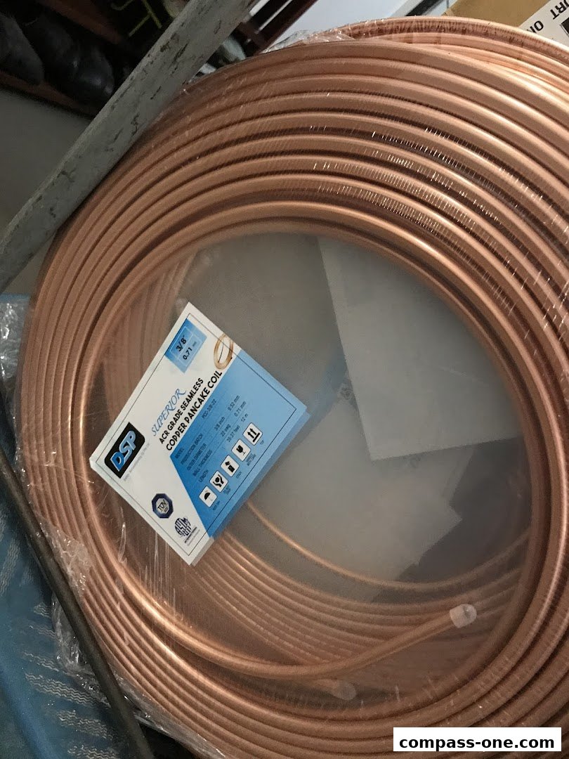 A coil of copper tubing with a product label indicating its specifications.