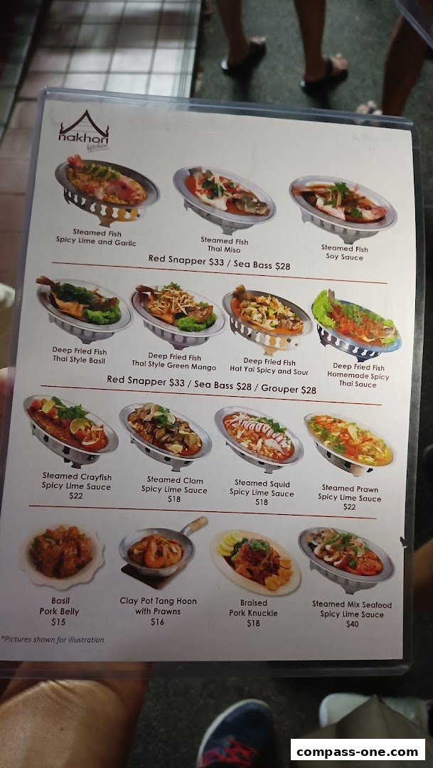 A menu from Nakhon Kitchen featuring various Thai seafood and pork dishes with prices.