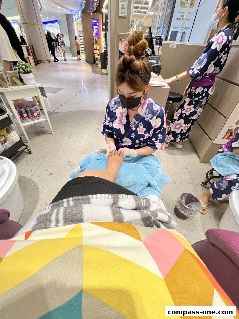 A nail technician performs a pedicure on a client at Pixie Nail Spa.