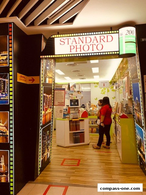 Entrance to Standard Photo, a DHL Express Service Point, with film strip decor.