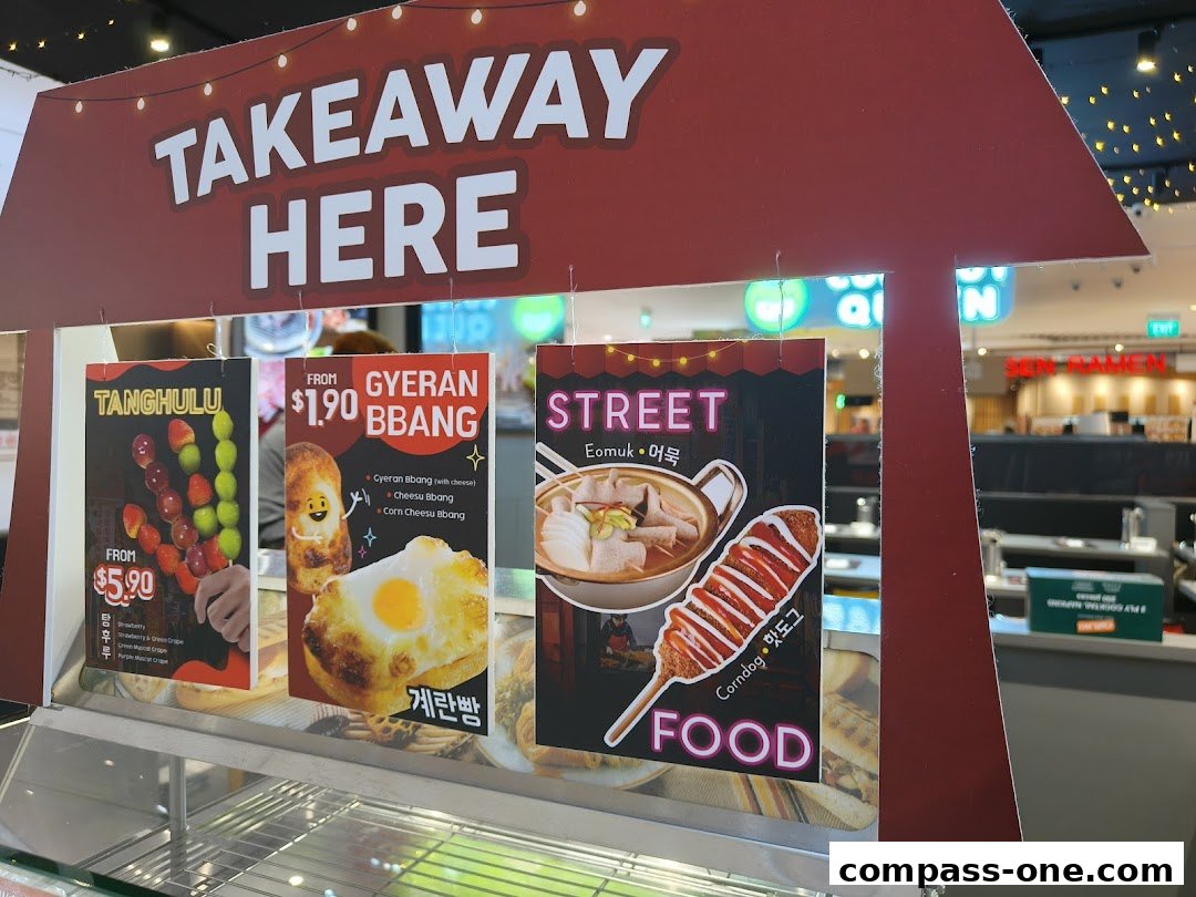 A display of Korean street food items including Tanghulu, Gyeran Bbang, and Corndogs.
