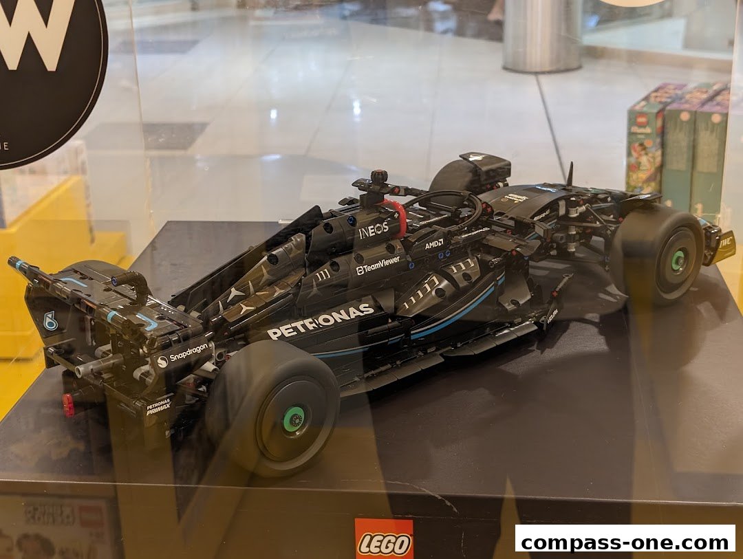A detailed LEGO model of a black Formula 1 race car is displayed.