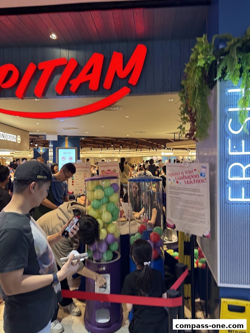 People queuing for a gashapon machine promotion at a shop.