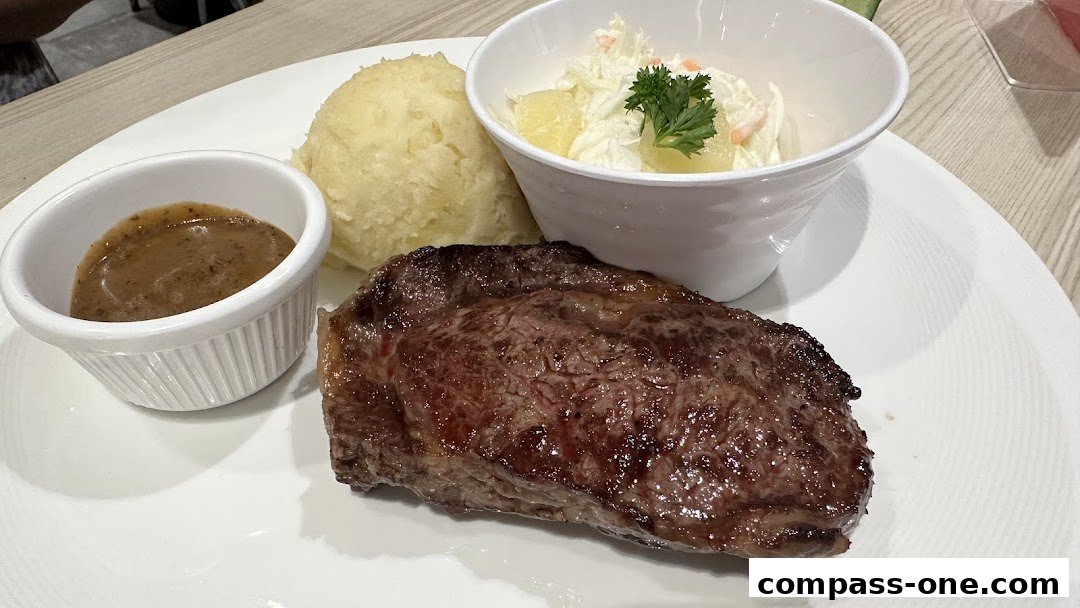 A juicy steak served with mashed potatoes, gravy, and coleslaw.