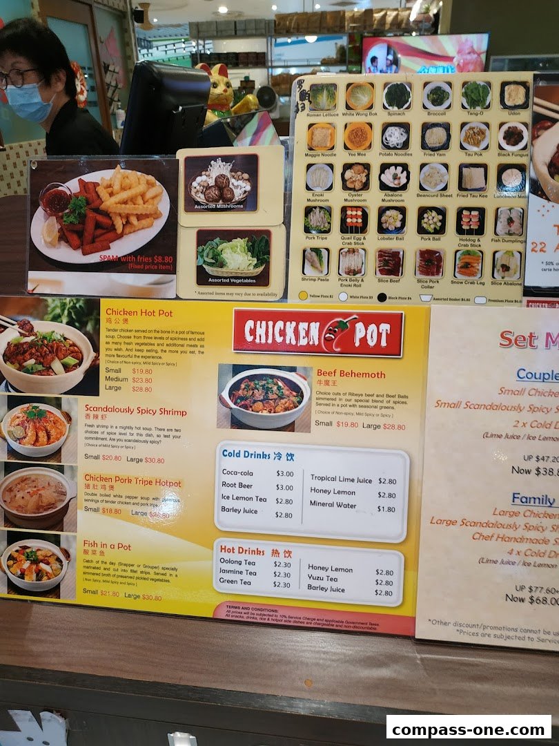 A menu board displays various hot pot dishes, side items, and drinks with prices.