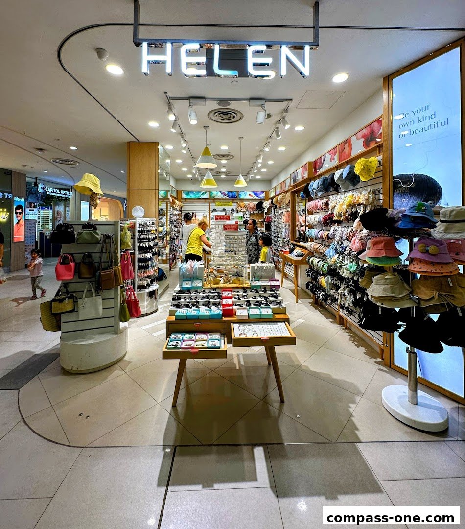 Interior view of a brightly lit shop selling hats, bags, and accessories.